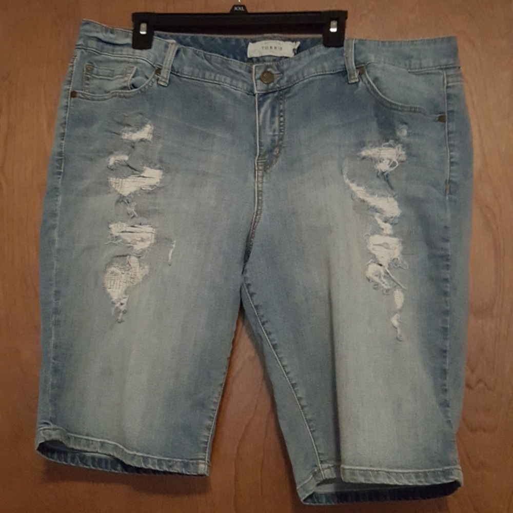 Torrid destructed Bermuda shorts.